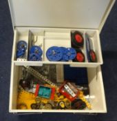 A collection of mixed Meccano parts including plates, strips, wheels, brackets etc.