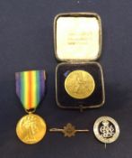 A Great War Victory medal awarded to J.J.G. Tregaskis, also two badges