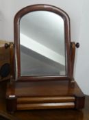 A 19th century toilet mirror and another oval framed mirror (2).