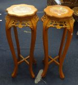 A pair of marble top and carved wood stands of Chinese design.