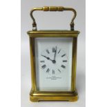 Brass carriage clock with platform escapement, height 16.50cm with handle up.