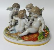 A 20th century German porcelain group, winged cherubs.