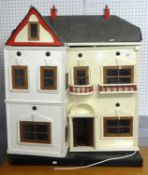 A traditional Lynes Dolls House and furniture.