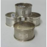 A group of four silver napkin rings.