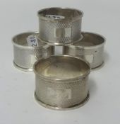 A group of four silver napkin rings.