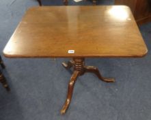 A 19th century mahogany tripod table with rectangular top.