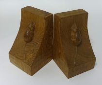 A pair of Robert Mouseman Thompson oak bookends, with carved mouse signature. 15 cm high.
