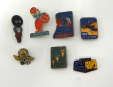 Various early Butlin's and other badges.