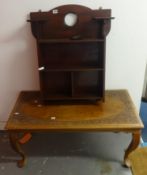 A mahogany shelf unit set with metal plaque, 61cm wide, and carved Indian coffee table