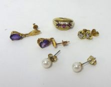 A pair of amethyst set drop earrings, a pair of peridot style earrings, a garnet 3 stone ring etc.