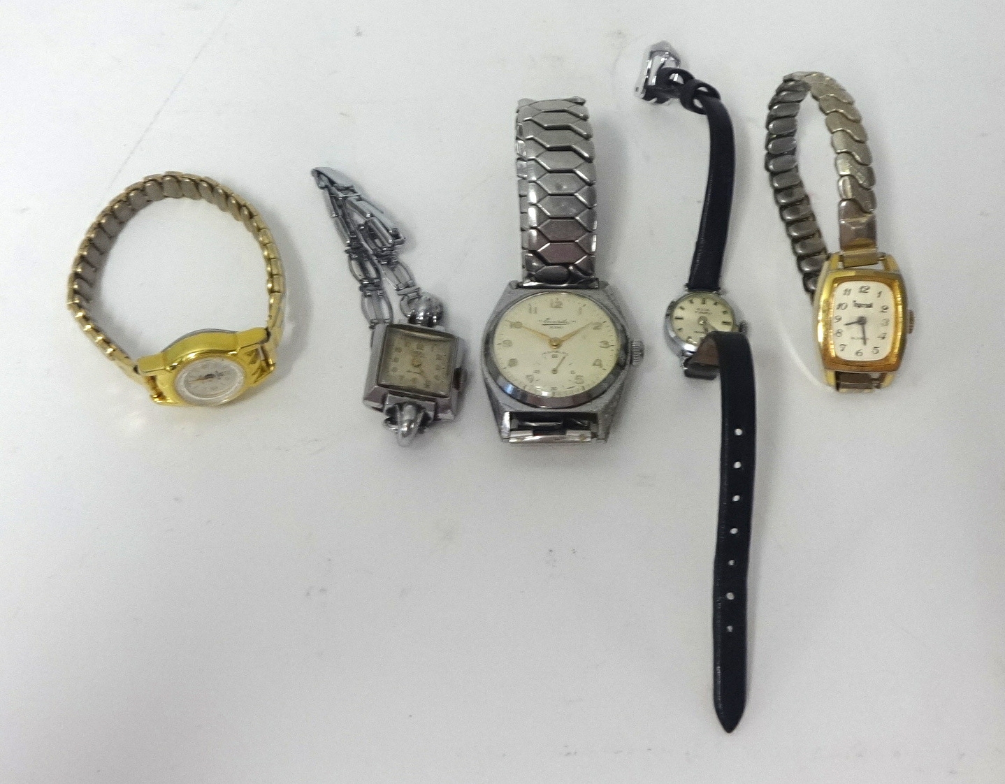 An Everite wrist watch and four other ladies watches.