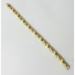 A diamond set yellow gold bracelet stamped .750, Pave set diamond sections, 19cm, approx. 25.5g.
