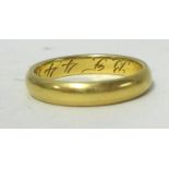 An 18ct gold wedding band, stamped .750, approx 4.10g.