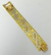 An 18K gold bracelet, yellow and white gold, ornate design with a large square clasp, approx 74.40g,