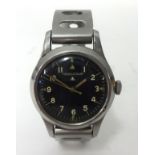 Jaeger Le Coultre, a military wrist watch, with black dial.