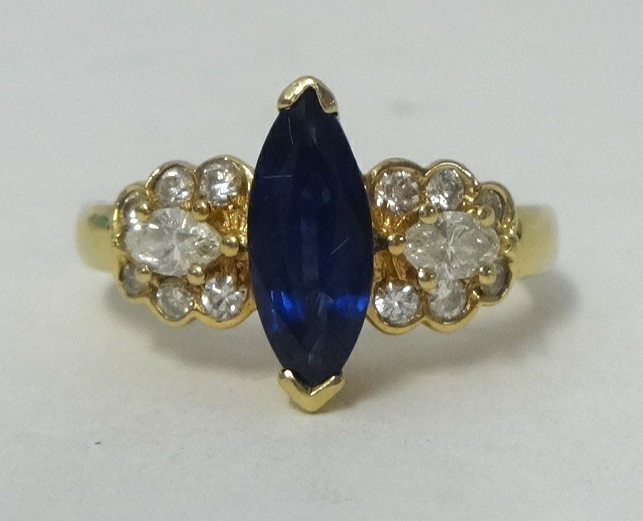 A 14k sapphire and diamond set ring, size J.