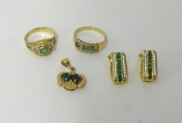 A pair 14ct emerald and diamond set earrings, also a pendant and a five stone ring and another.