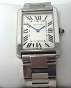 Cartier, a well kept Gents steel Tank wrist watch, with original box.