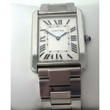 Cartier, a well kept Gents steel Tank wrist watch, with original box.