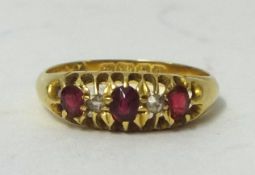 An 18ct ruby and diamond set ring, size M.