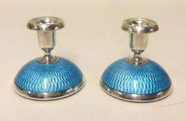 David Anderson a pair of Norway Sterling silver and enamelled small candlesticks,