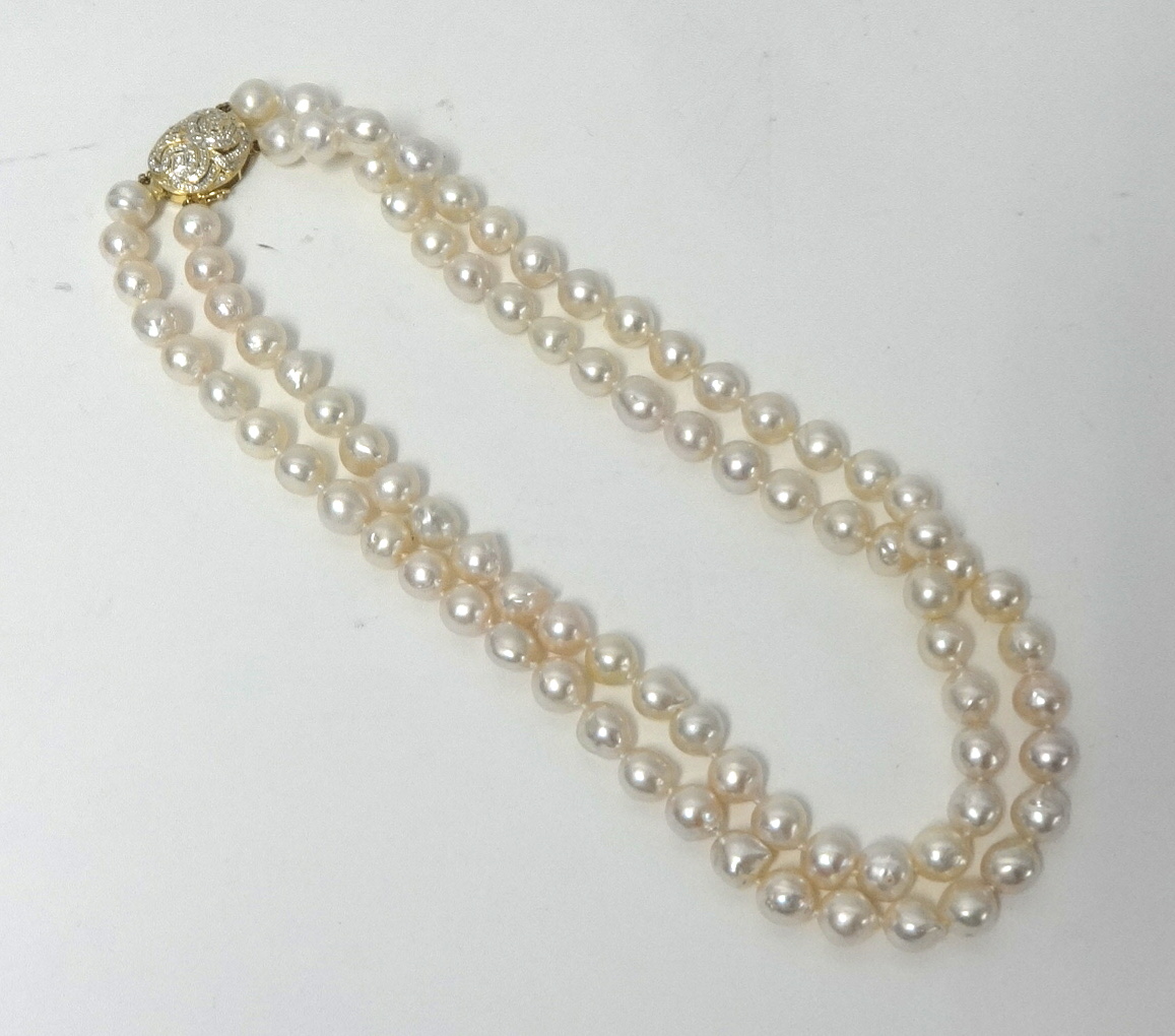 A set of pearls, possibly cultured, with an 18ct yellow gold and diamond clasp,