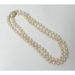 A set of pearls, possibly cultured, with an 18ct yellow gold and diamond clasp,