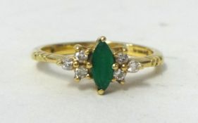 An 18ct marquise cut emerald set ring, set with 6 diamonds, size J.,