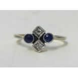 An 18ct diamond and sapphire set ring, set with four stones. Size N.