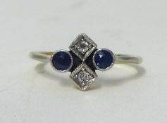 An 18ct diamond and sapphire set ring, set with four stones. Size N.