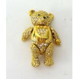 A modern 'Joan Rivers' gilt and encrusted teddy bear brooch.