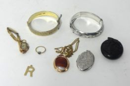 Various jewellery including a silver bangle, a gilt bangle, gold and other items.