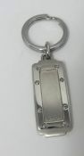 Cartier, a Santos watch key ring, boxed.