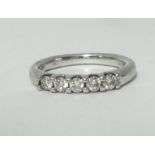A white gold and diamond set 5 stone ring, approx. .30 carat, stamped 1/3.