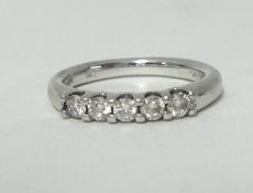 A white gold and diamond set 5 stone ring, approx. .30 carat, stamped 1/3.