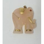 A rose quartz elephant set with a ruby eye, height 35mm.