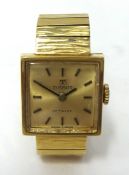 Tissot, a Ladies 9ct gold wrist watch, with 9ct gold bracelet, (total weight 27.30g).