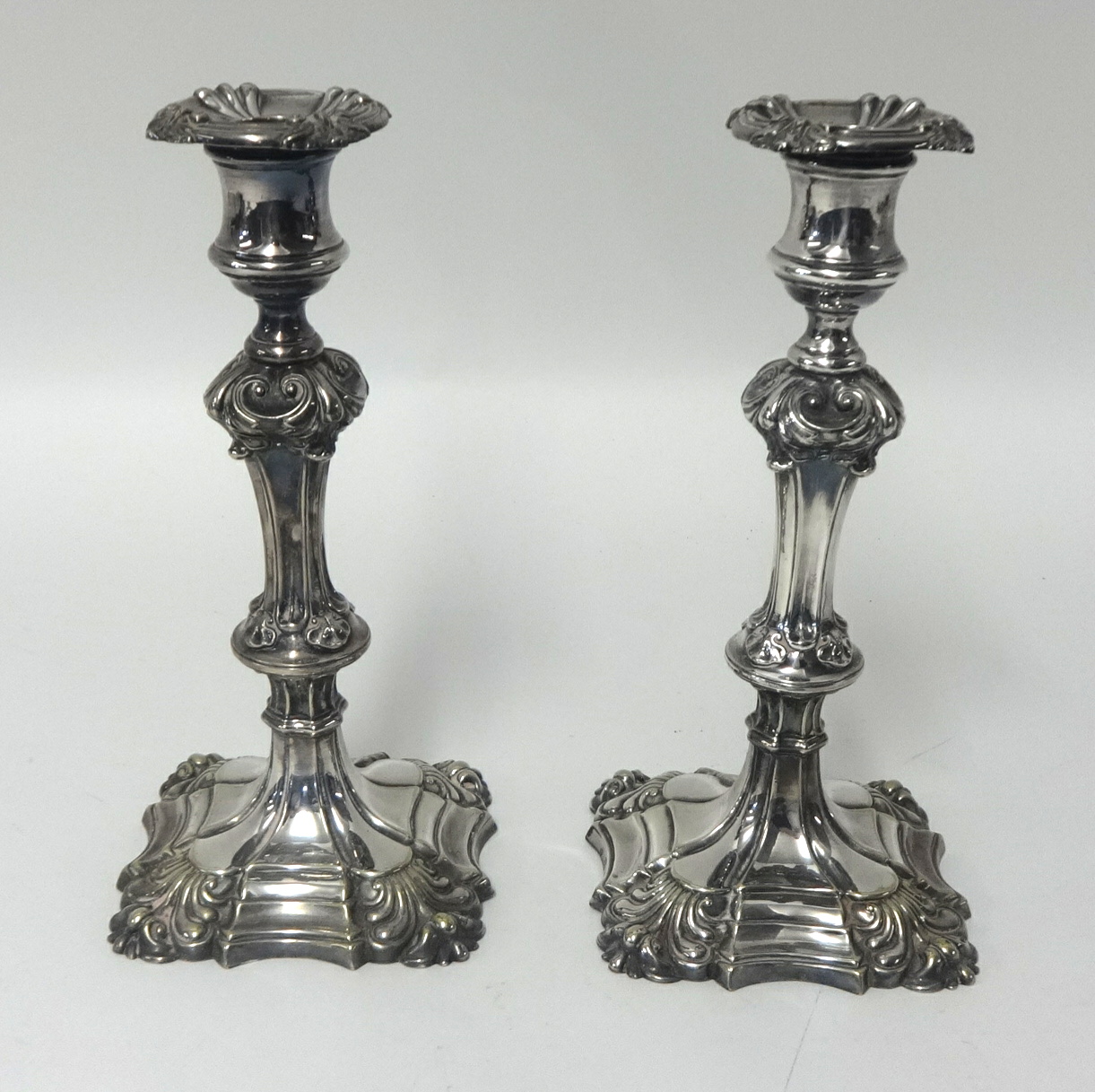 A pair of silver plated candlesticks, height 24cm.