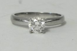 A platinum and diamond set solitaire ring, 0.54ct, VS1, colour E, brilliant cut stone, purchased new