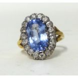 An 18ct antique sapphire and diamond set cluster ring, size M.