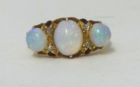 An 18ct 3 stone opal ring, size N.