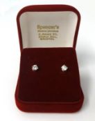 A pair of 18ct yellow and white gold claw set diamond ear studs, approx. .50ct
