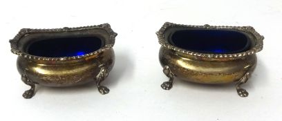 A pair silver table salts with blue glass liners, (2).