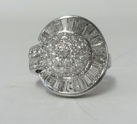 An 18ct white gold and diamond set with approx 4ct of round and baguette cut diamonds, size M.