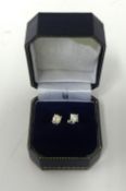 A pair of diamond ear studs, approx 1.00 carat.