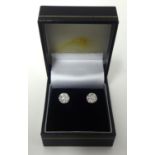 A pair of good quality diamond cluster earrings set in white gold.