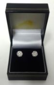 A pair of good quality diamond cluster earrings set in white gold.