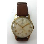 Tudor, a Gents 9ct gold wrist watch, with inscription on back plate.