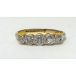 A five stone diamond ring, old cut stones.18ct shank and a platinum setting, ring size R1/2.