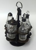 Five cruet bottles on wood stand, some Victorian silver mounted, also a glass hinged box, a